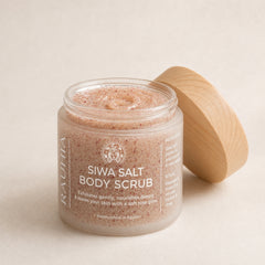 Siwa salt body scrub with rose and oils. open jar showing fine salt texture